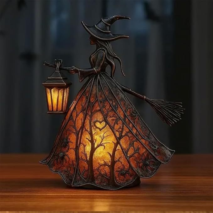 Witch figurine with a lantern