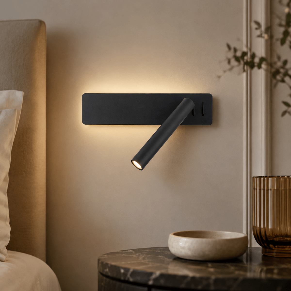 LED wall light with a swiveling lamp