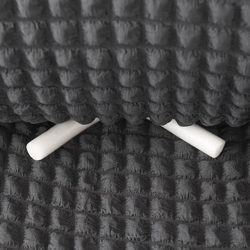 Pokrowiec na sofę z falbaną