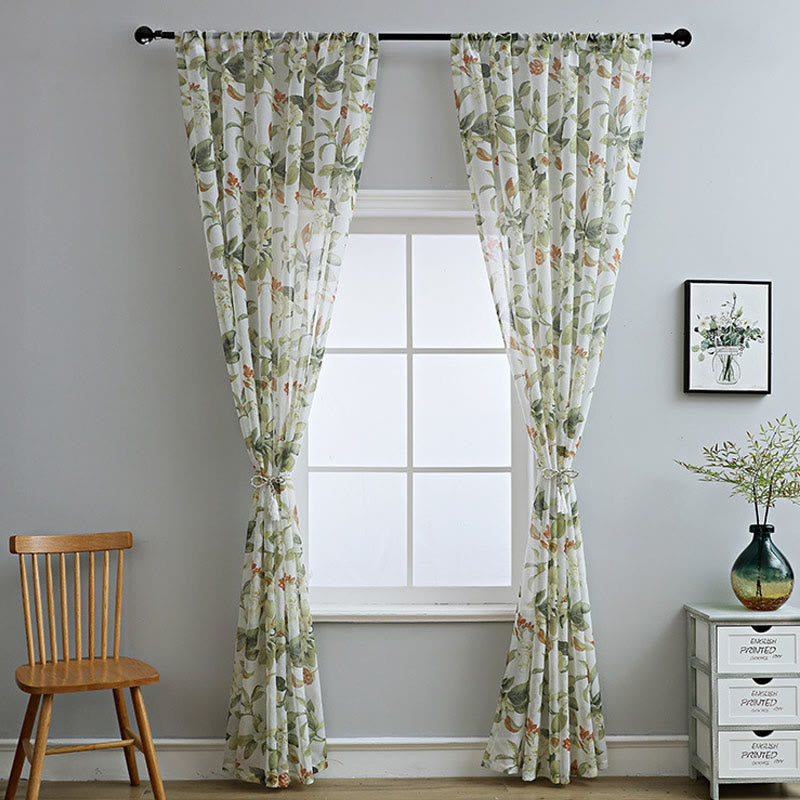 Sheer curtain with a floral pattern