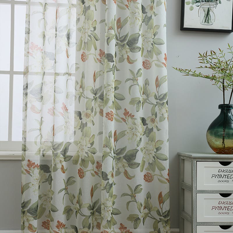 Sheer curtain with a floral pattern