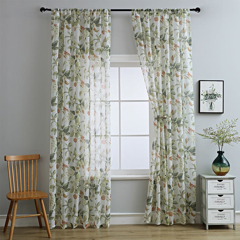 Sheer curtain with a floral pattern