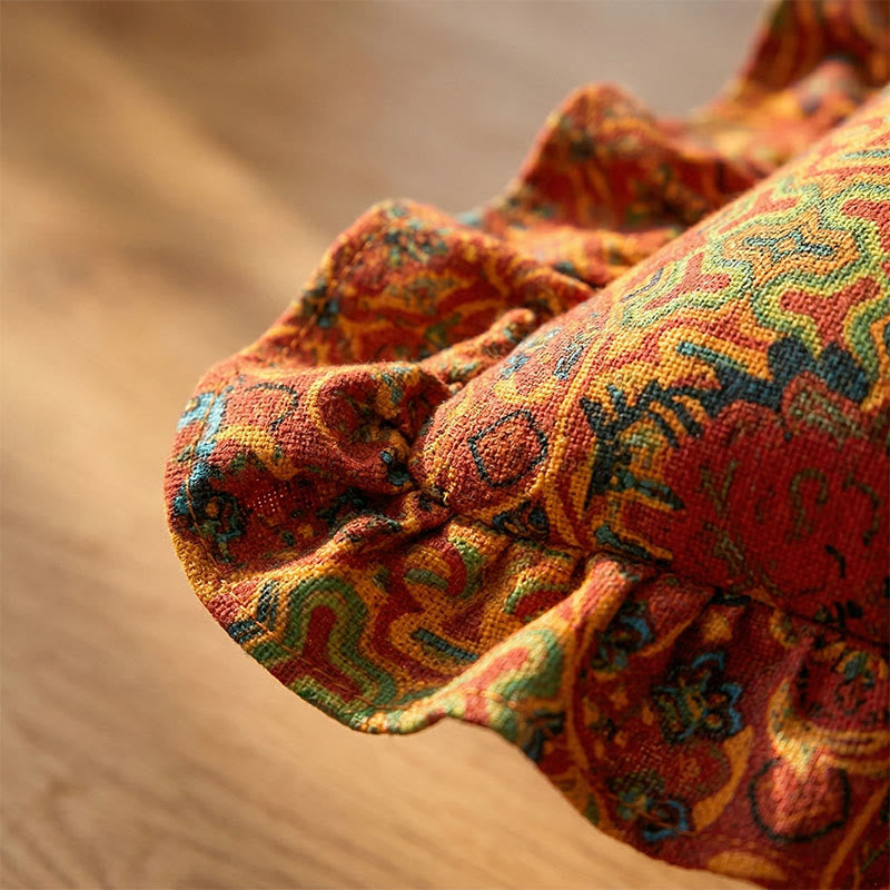 Coussin géométrique avec franges et volant