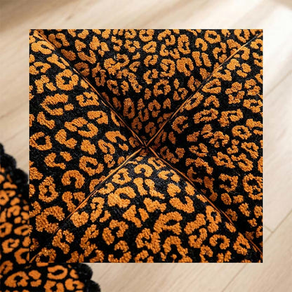 Coussin à motif léopard avec pompons