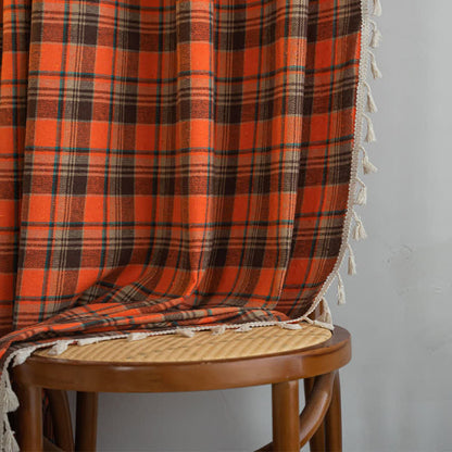 Orange checked curtain with tassels