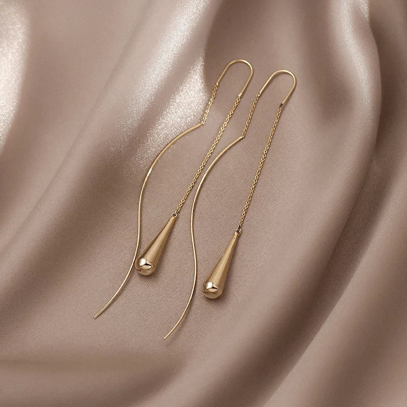 Boucles d’oreilles dorées en forme de goutte