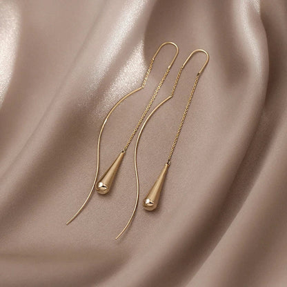 Boucles d’oreilles dorées en forme de goutte