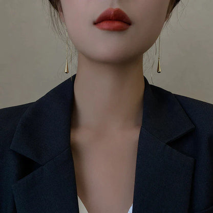 Boucles d’oreilles dorées en forme de goutte