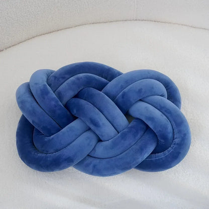 Decorative cushion with a knot pattern