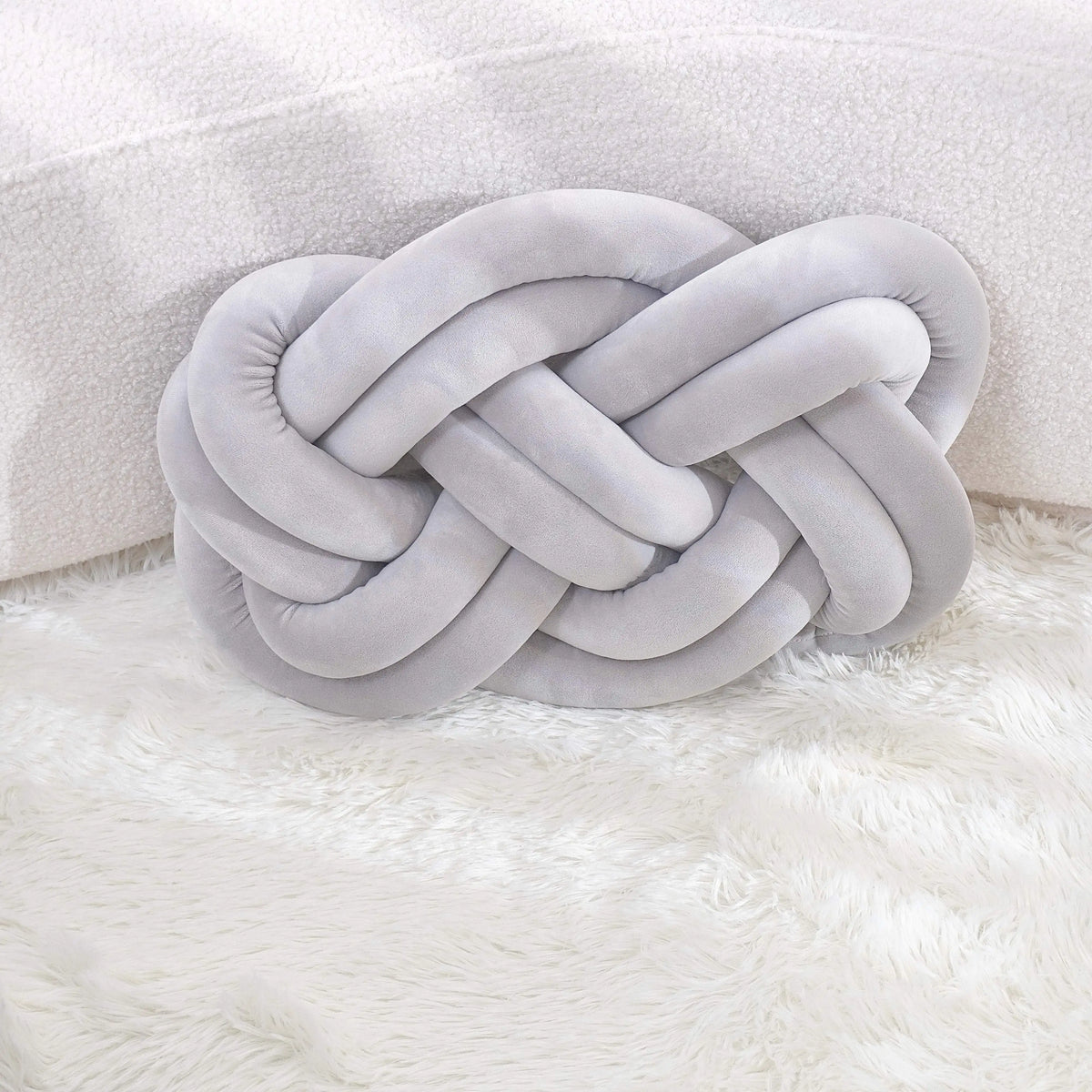 Decorative cushion with a knot pattern