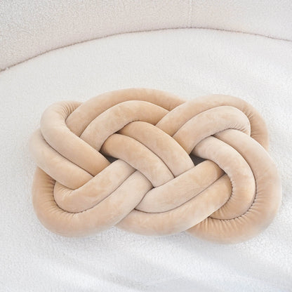 Decorative cushion with a knot pattern