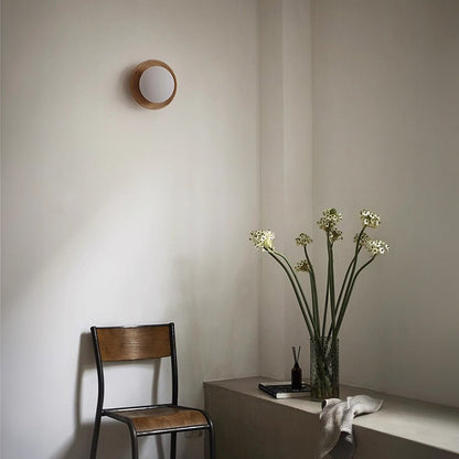 Wall lamp with a shade and wood