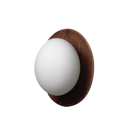 Wall lamp with a shade and wood