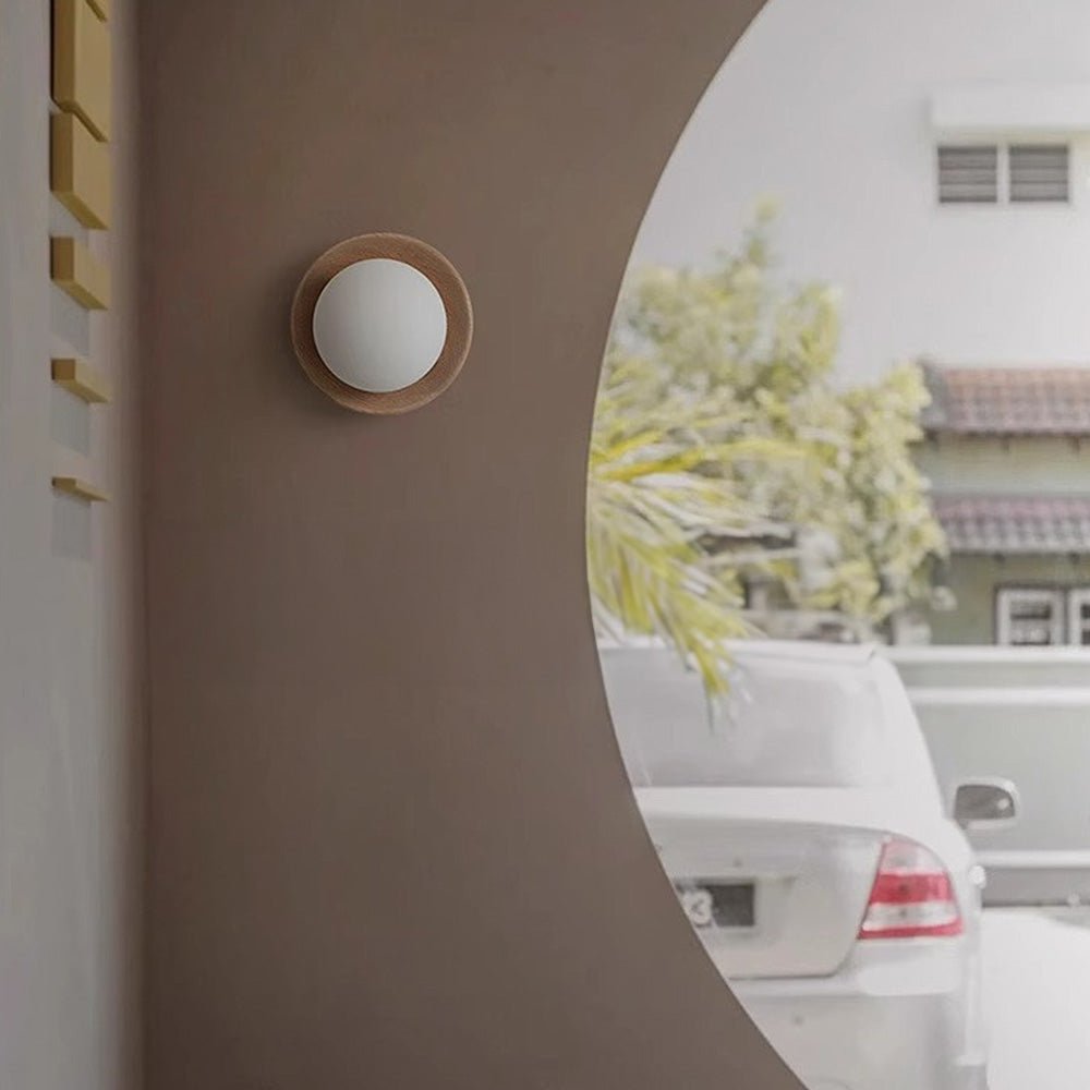 Wall lamp with a shade and wood