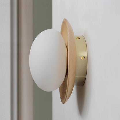 Wall lamp with a shade and wood