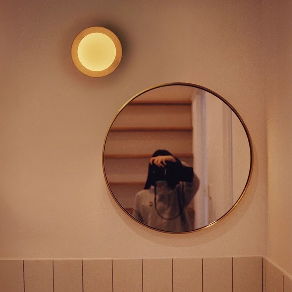Wall lamp with a shade and wood
