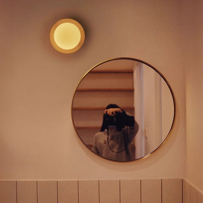 Wall lamp with a shade and wood