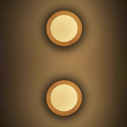Wall lamp with a shade and wood