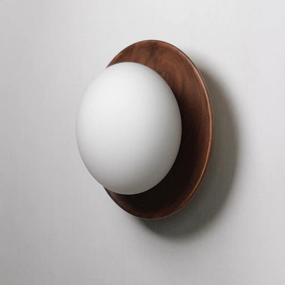 Wall lamp with a shade and wood