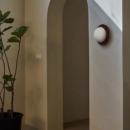 Wall lamp with a shade and wood