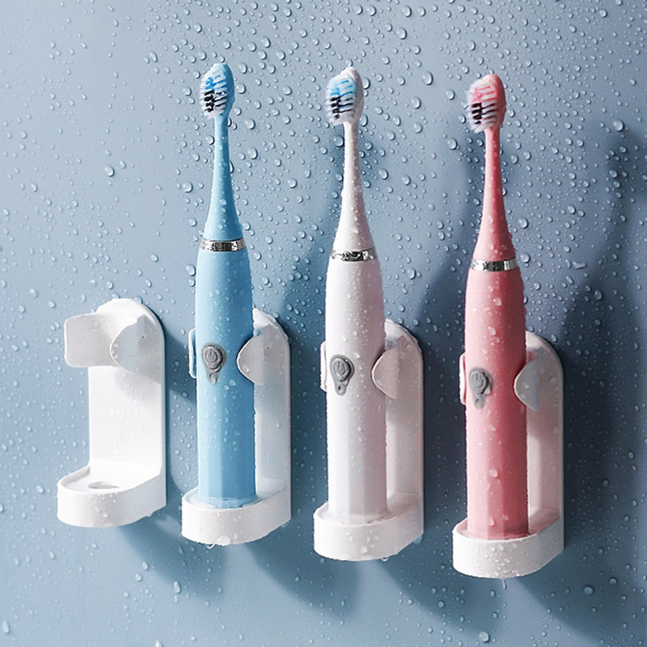 Self-adhesive toothbrush holder
