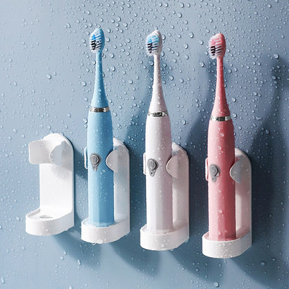 Self-adhesive toothbrush holder