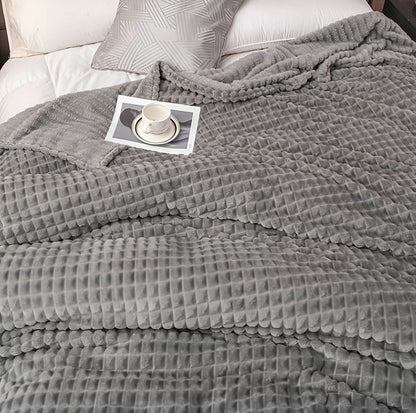 Blanket with a textured surface