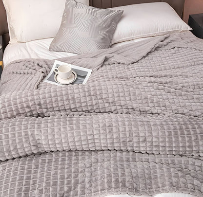 Blanket with a textured surface