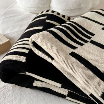 Couverture à motif noir et beige