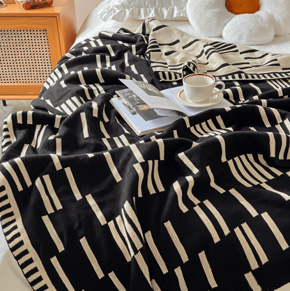 Couverture à motif noir et beige