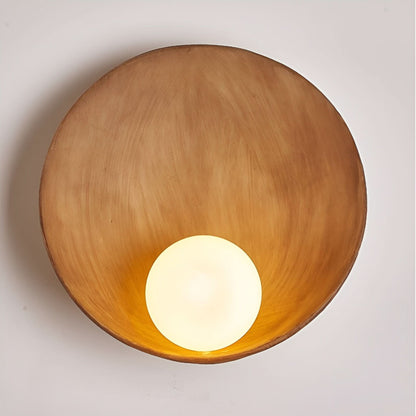 Wall lamp with a rounded design