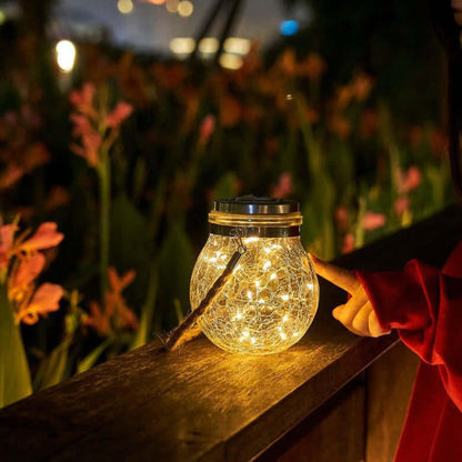 Solar garden lamp with a glass shade