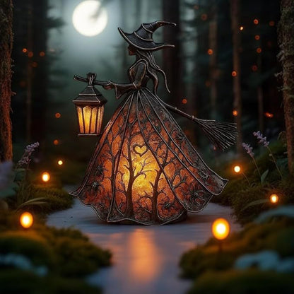 Witch figurine with a lantern
