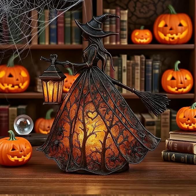 Witch figurine with a lantern