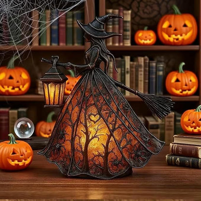 Witch figurine with a lantern