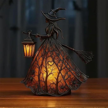 Witch figurine with a lantern
