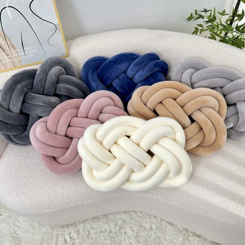 Decorative cushion with a knot pattern