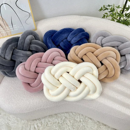 Decorative cushion with a knot pattern