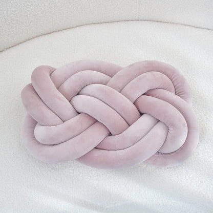 Decorative cushion with a knot pattern