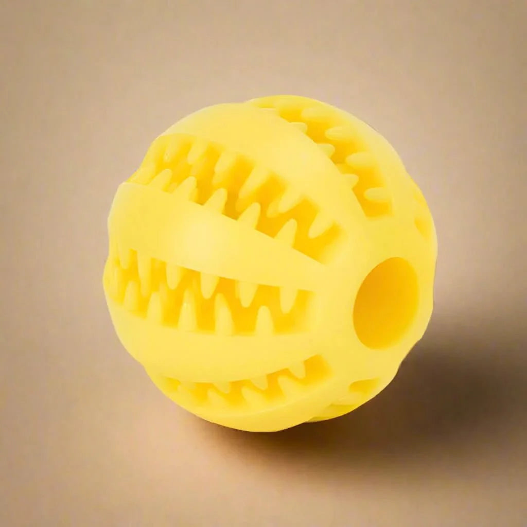 Dog ball with treat dispenser function