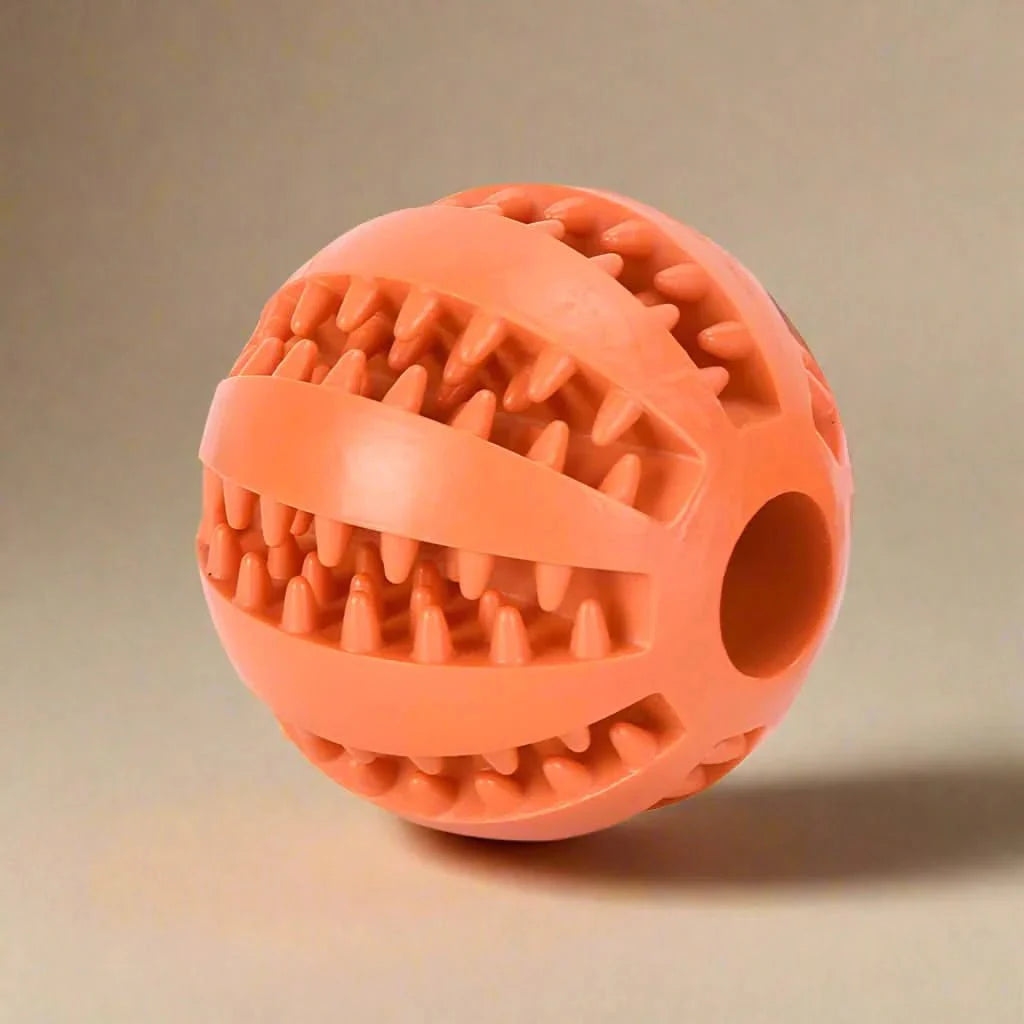 Dog ball with treat dispenser function
