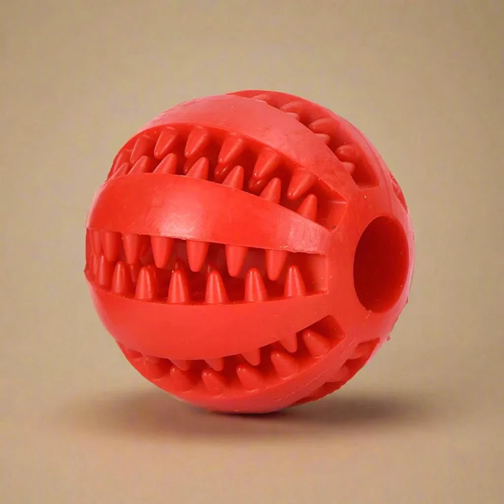 Dog ball with treat dispenser function