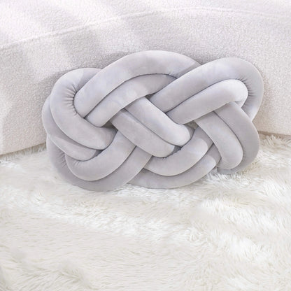 Decorative cushion with a knot pattern