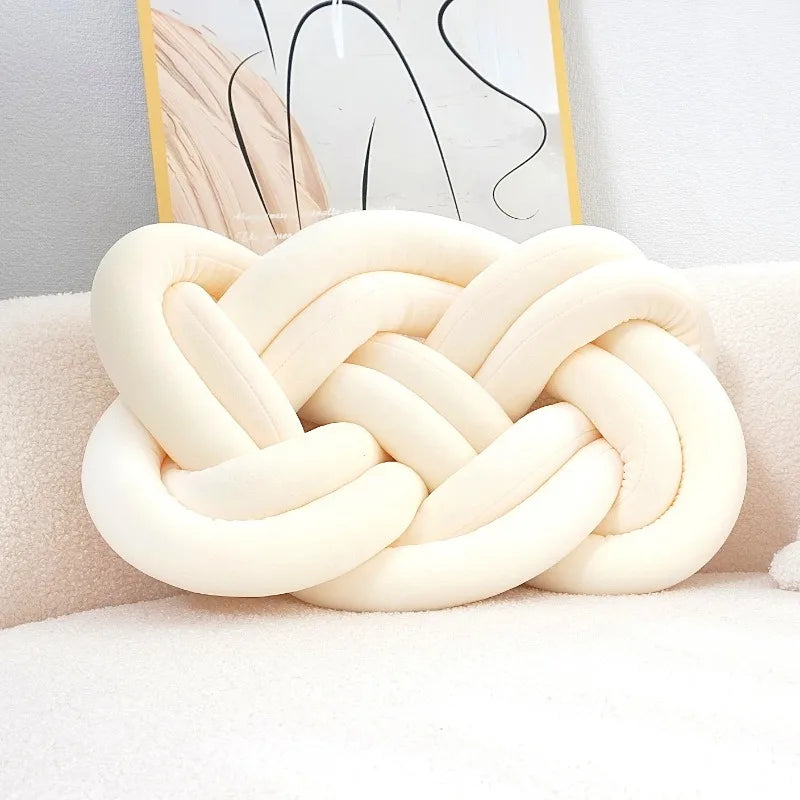 Decorative cushion with a knot pattern