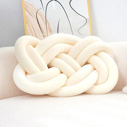 Decorative cushion with a knot pattern