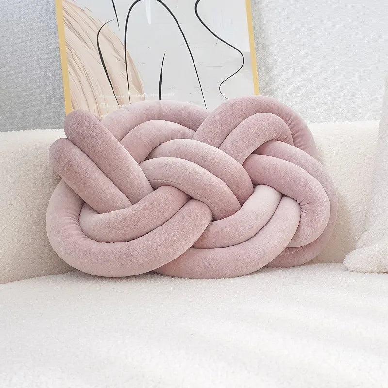 Decorative cushion with a knot pattern