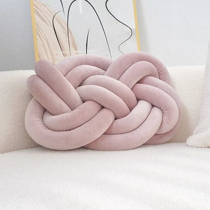 Decorative cushion with a knot pattern