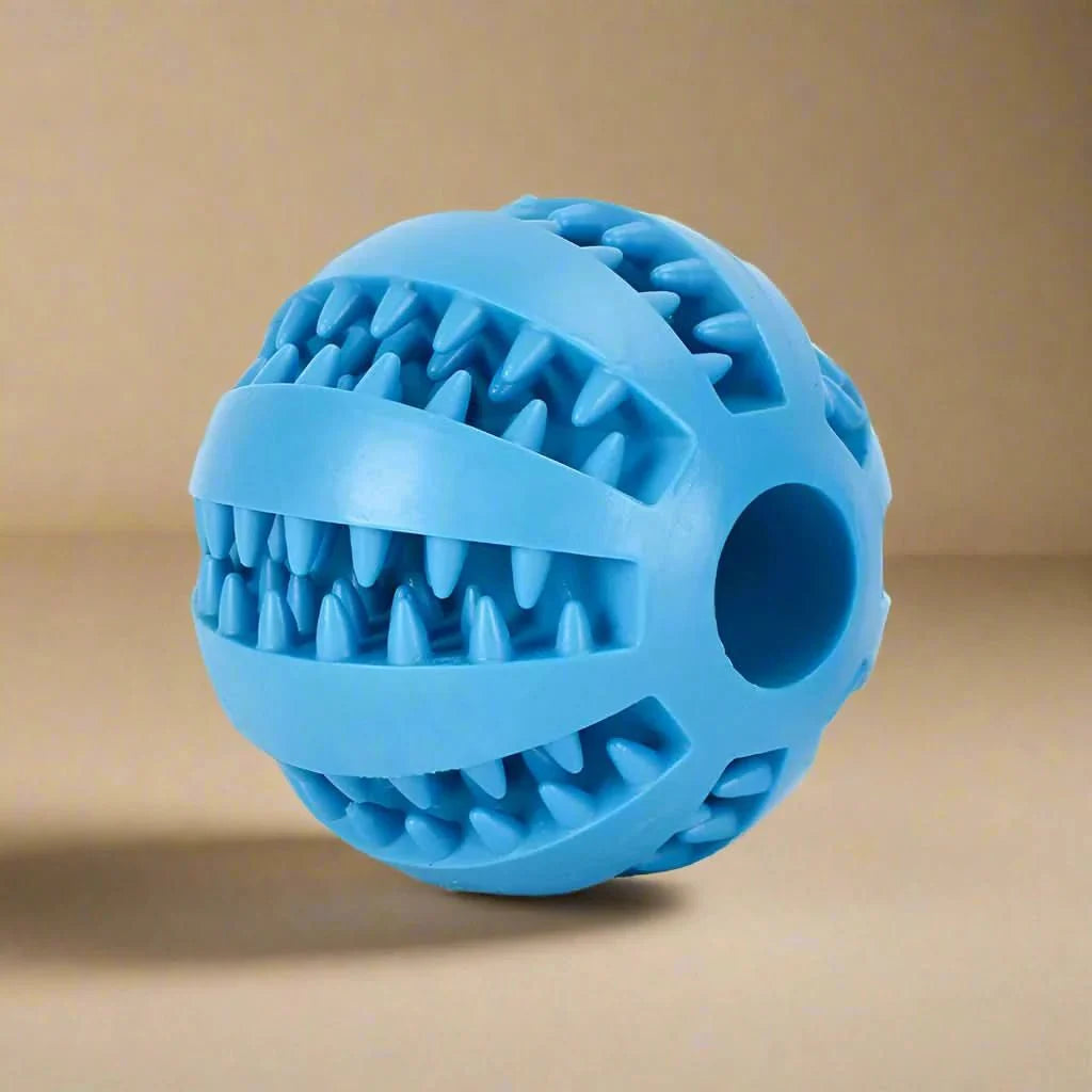 Dog ball with treat dispenser function