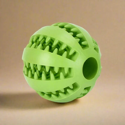 Dog ball with treat dispenser function