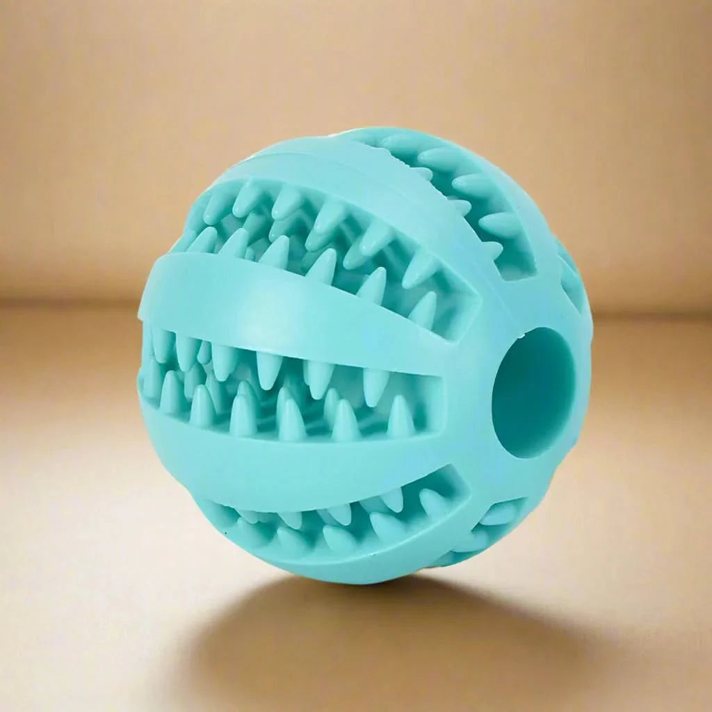 Dog ball with treat dispenser function